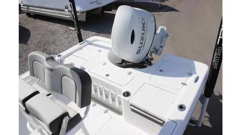 Slide: The Image of 2025 Sea Pro 210 boat with Suzuki outboard motor, featuring sleek seating and storage compartments. - 16