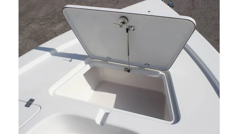 Slide: The Image of Open storage compartment on 2025 Sea Pro 210 boat deck. - 9