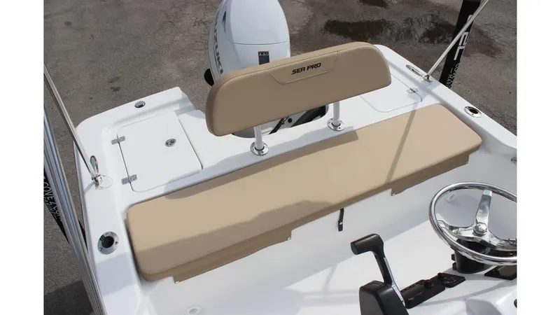 Slide: The Image of 2025 Sea Pro 172 boat interior with beige seating and steering wheel. - 13