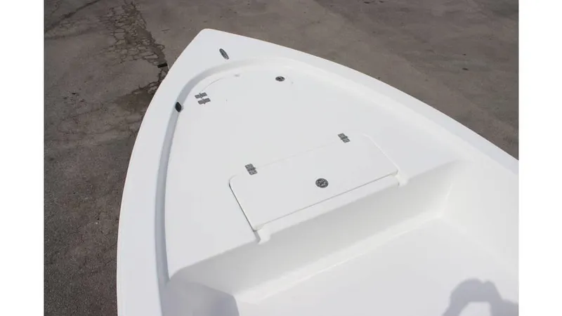 Slide: The Image of 2025 Sea Pro 172 boat deck, featuring a sleek, white design on a concrete surface. - 17