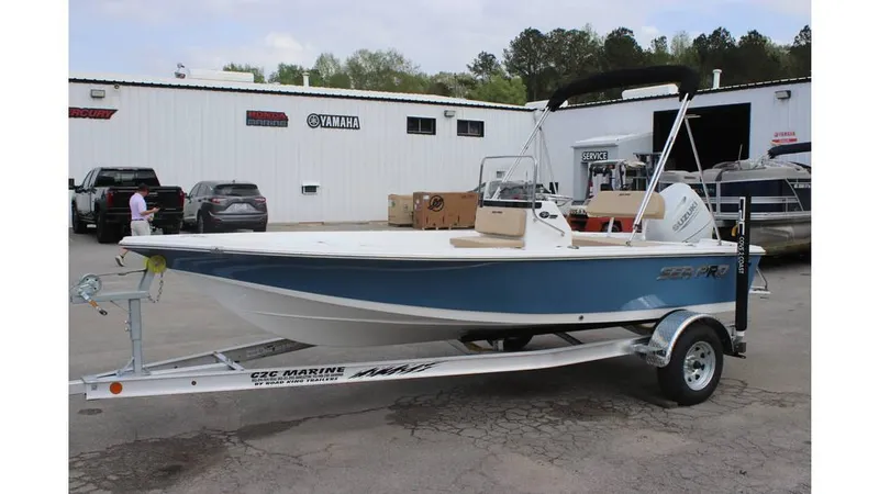 Slide: The Image of 2025 Sea Pro 172 boat on trailer, parked outside dealership. - 4