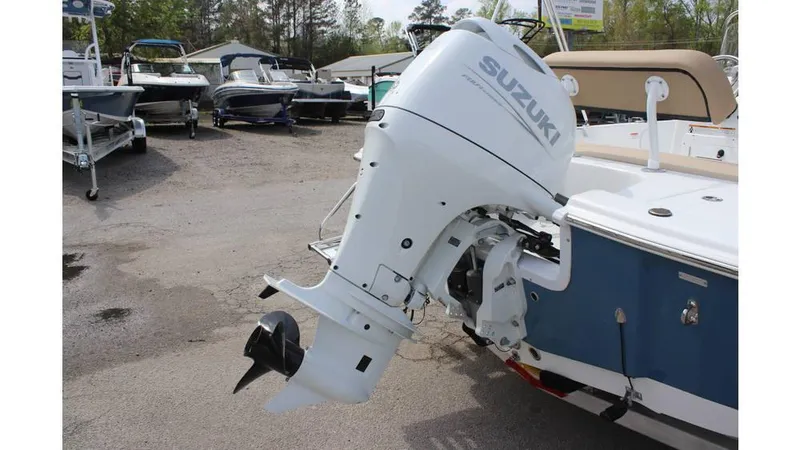 Slide: The Image of 2025 Sea Pro 172 boat with Suzuki outboard motor in a marina setting. - 8