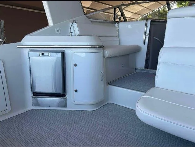 Slide: The Image of Interior of 1994 Chris-Craft 340 Crowne boat with seating and cabinetry. - 10