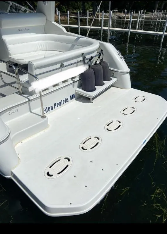 Slide: The Image of 1994 Chris-Craft 340 Crowne boat with spacious swim platform and seating area. - 15