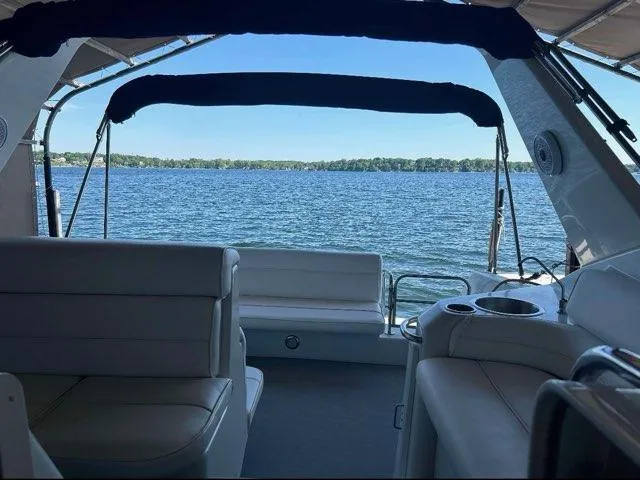Slide: The Image of Interior view of 1994 Chris-Craft 340 Crowne yacht overlooking serene lake. - 9