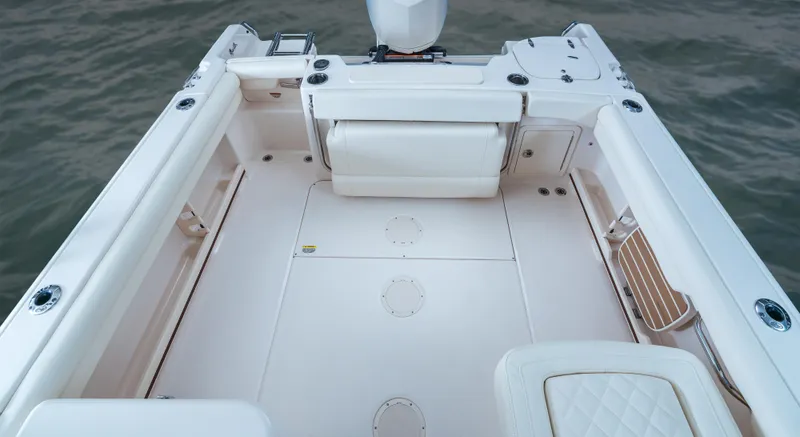 Slide: The Image of 2025 Grady-White Freedom 255 boat interior with spacious seating and clean design. - 8