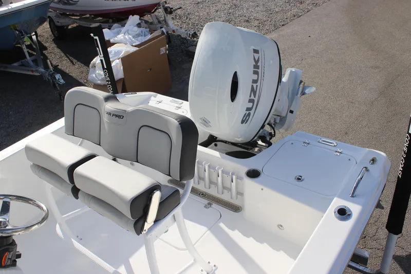 Slide: The Image of 2025 Sea Pro 202 CC boat with Suzuki outboard motor, featuring comfortable seating. - 11
