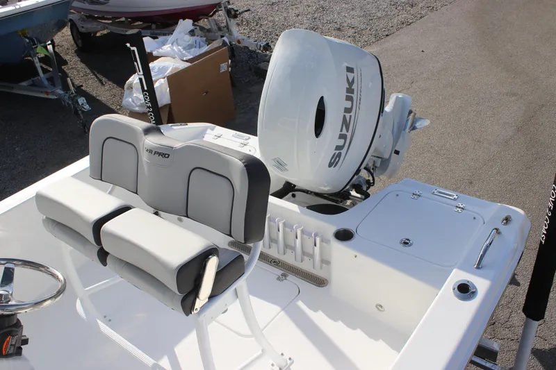 Slide: The Image of 2025 Sea Pro 202 CC boat with Suzuki outboard motor, featuring comfortable seating. - 12