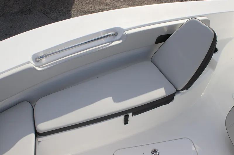 Slide: The Image of 2025 Sea Pro 202 CC boat interior with cushioned seating and sleek design. - 13