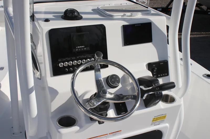 Slide: The Image of 2025 Sea Pro 202 CC boat console with steering wheel and navigation controls. - 5