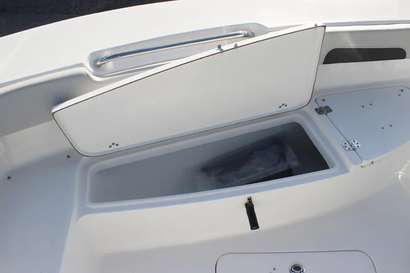 Slide: The Image of 2025 Sea Pro 202 CC boat storage compartment with open hatch, showcasing spacious interior. - 8