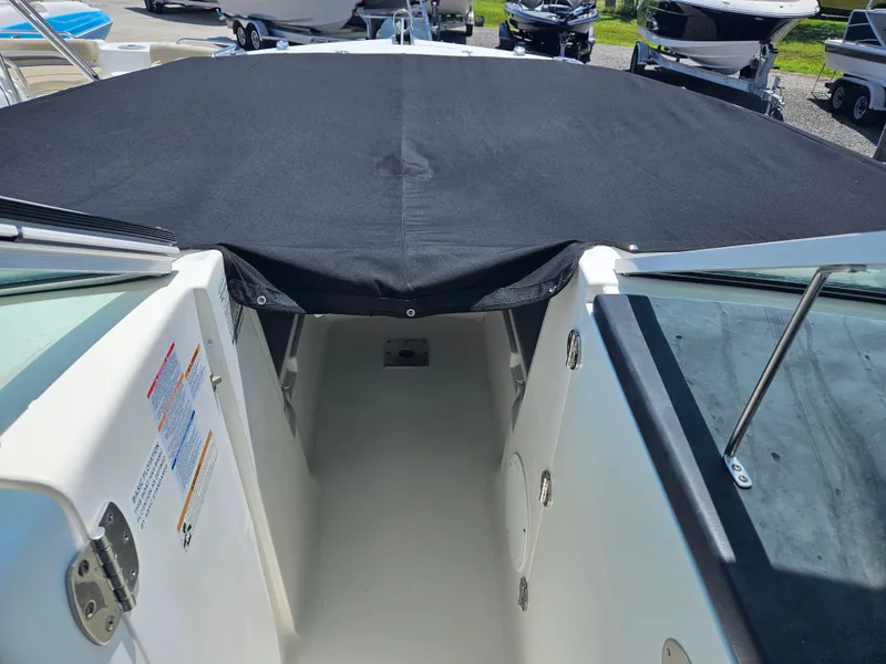 Slide: The Image of 2015 Robalo R247 Dual Console boat with Yamaha outboard engine on trailer. - 25