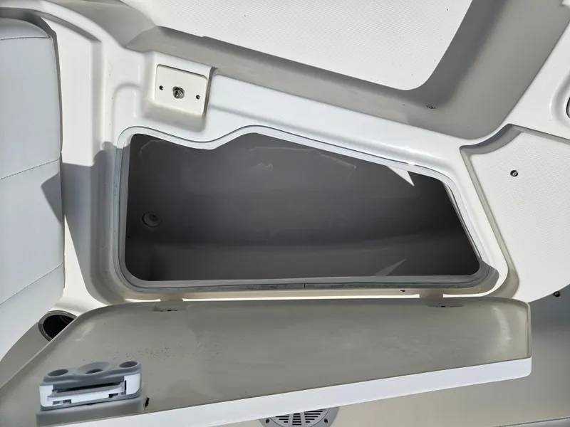 Slide: The Image of 2015 Robalo R247 Dual Console boat interior with steering wheel and dashboard. - 26