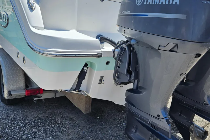 Slide: The Image of 2015 Robalo R247 Dual Console boat with spacious seating and sleek design. - 31