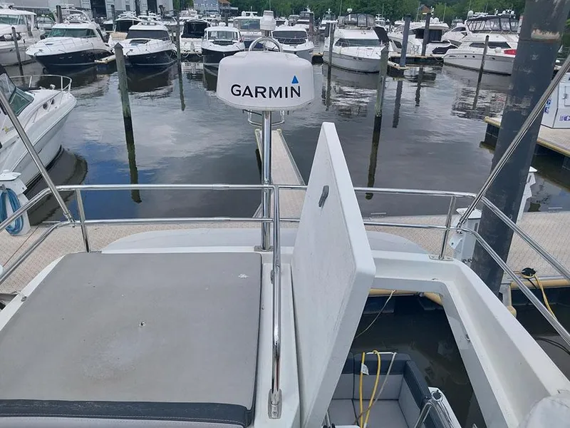 Slide: The Image of 2023 Jeanneau NC 1095 Fly with Garmin radar at marina. - 20