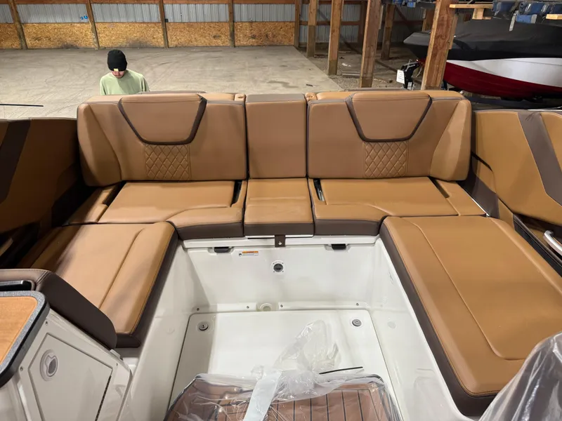 Slide: The Image of 2025 Yamaha Boats 252SD interior with tan leather seating in a spacious layout. - 8