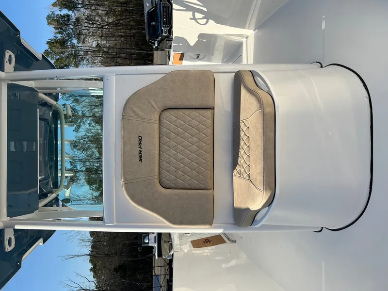 Slide: The Image of 2022 Sea Pro 259 Deep V Series CC boat interior with cushioned seating. - 13