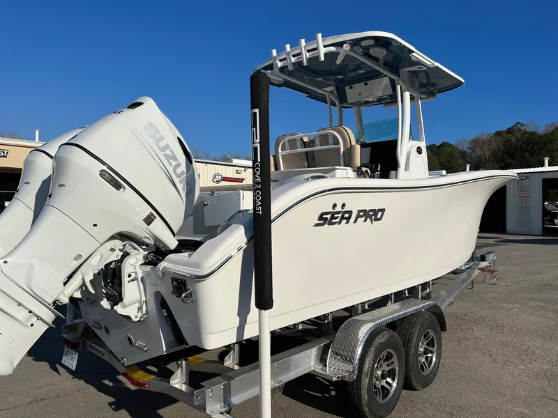 Slide: The Image of 2022 Sea Pro 259 Deep V Series CC boat with Suzuki outboard motor on trailer. - 16