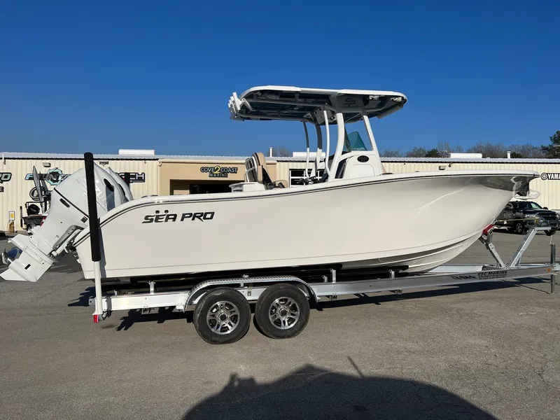Slide: The Image of 2022 Sea Pro 259 Deep V Series CC boat on trailer, parked outdoors. - 17
