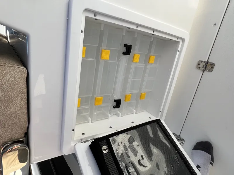 Slide: The Image of Storage compartment on a 2022 Sea Pro 259 Deep V Series CC boat. - 19