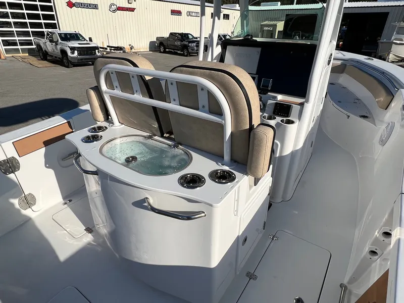 Slide: The Image of 2022 Sea Pro 259 Deep V Series CC boat interior with seating and livewell. - 21