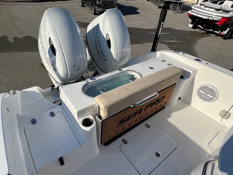 Slide: The Image of 2022 Sea Pro 259 Deep V Series CC boat with dual Suzuki outboard engines. - 4