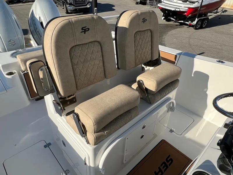 Slide: The Image of 2022 Sea Pro 259 Deep V Series CC boat seats with beige upholstery and diamond stitching. - 5