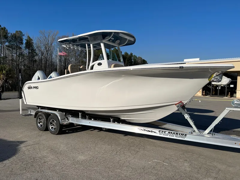 Slide: The Image of 2022 Sea Pro 259 Deep V Series CC boat on trailer, parked outdoors. - 6