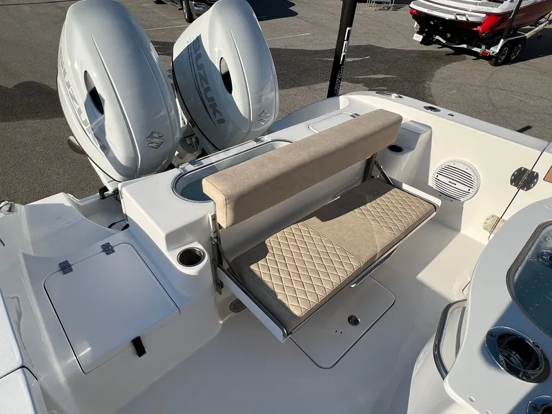 Slide: The Image of 2022 Sea Pro 259 Deep V Series CC boat with dual Suzuki engines and cushioned seating. - 7