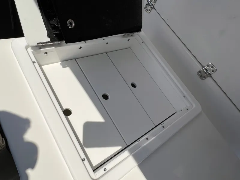 Slide: The Image of 2022 Sea Pro 259 Deep V Series CC storage compartment with open hatch. - 9