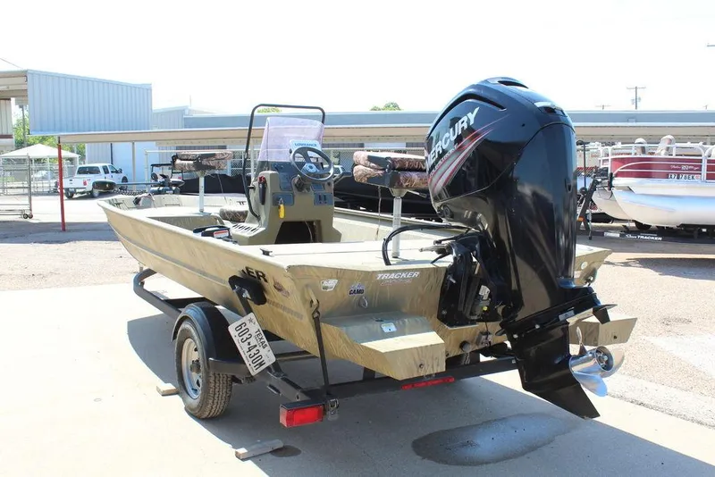 Slide: The Image of 2018 Tracker GRIZZLY® 1860 CC boat with Mercury outboard motor on a trailer. - 10