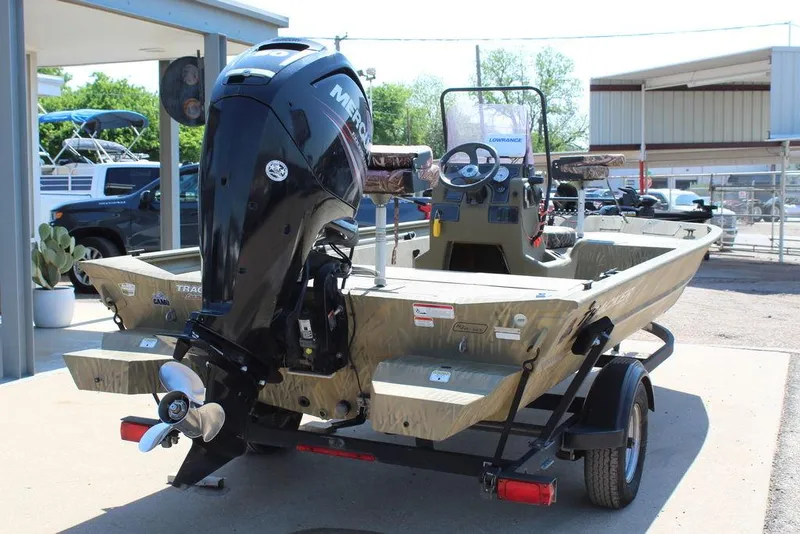 Slide: The Image of 2018 Tracker GRIZZLY® 1860 CC boat with Mercury outboard motor on trailer. - 11