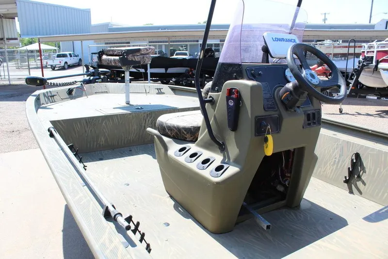 Slide: The Image of 2018 Tracker GRIZZLY® 1860 CC boat interior with steering console and seating. - 3