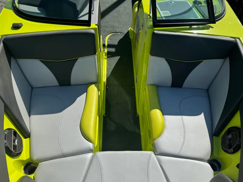 Slide: The Image of 2018 MasterCraft XT22 boat interior with gray and lime green seating. - 12