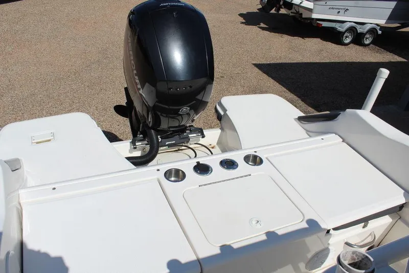 Slide: The Image of 2021 Bayliner T20CC boat with outboard motor and deck features. - 3