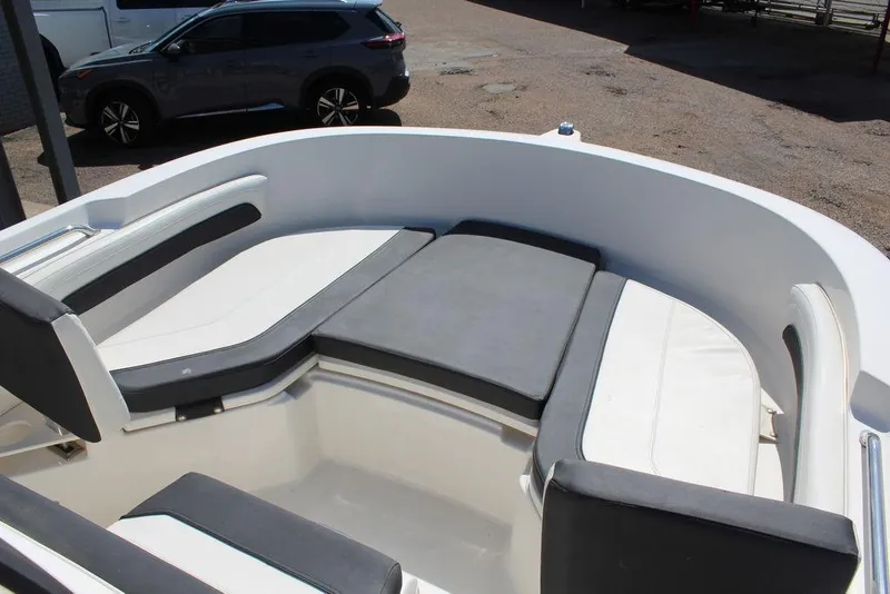 Slide: The Image of 2021 Bayliner T20CC boat interior with cushioned seating and modern design. - 6