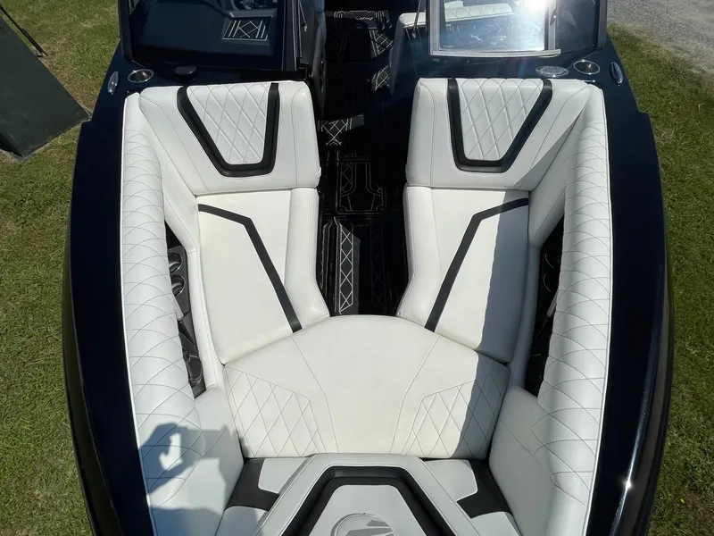 Slide: The Image of Luxurious interior of 2021 Tigé 23ZX boat with white and black seating. - 10