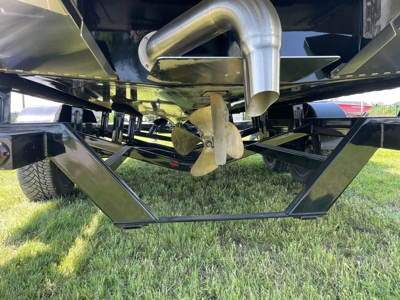 Slide: The Image of Underneath view of a 2021 Tigé 23ZX boat showing propeller and exhaust system. - 3