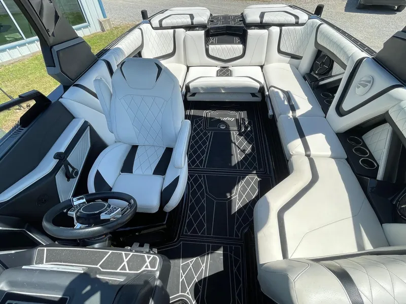 Slide: The Image of 2021 Tigé 23ZX boat interior with luxurious seating and modern design. - 7