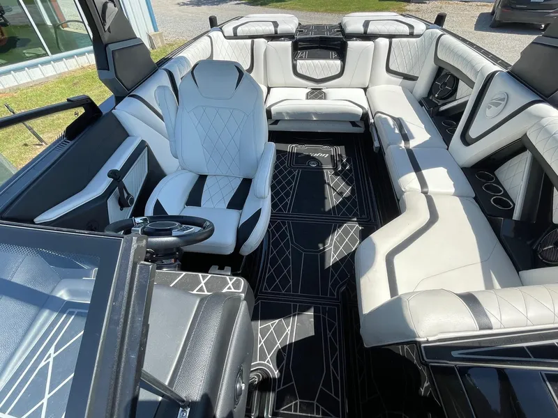 Slide: The Image of 2021 Tigé 23ZX boat interior with luxurious seating and modern design. - 8
