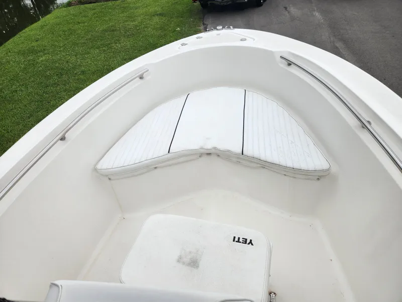 Slide: The Image of 2008 Pioneer 197 Sportfish boat interior with cushioned seating and YETI cooler. - 11