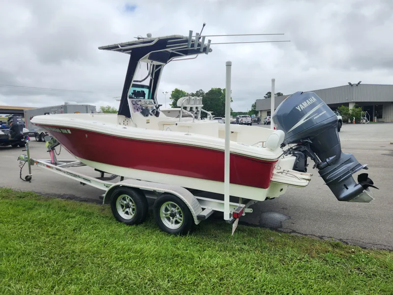 Slide: The Image of 2008 Pioneer 197 Sportfish boat with Yamaha outboard on trailer, parked on grass. - 5