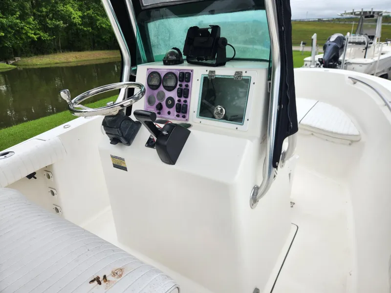 Slide: The Image of 2008 Pioneer 197 Sportfish boat console with steering wheel and control panel. - 7