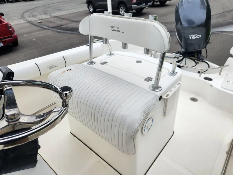 Slide: The Image of 2008 Pioneer 197 Sportfish boat interior with steering wheel and Yamaha 150 outboard motor. - 8