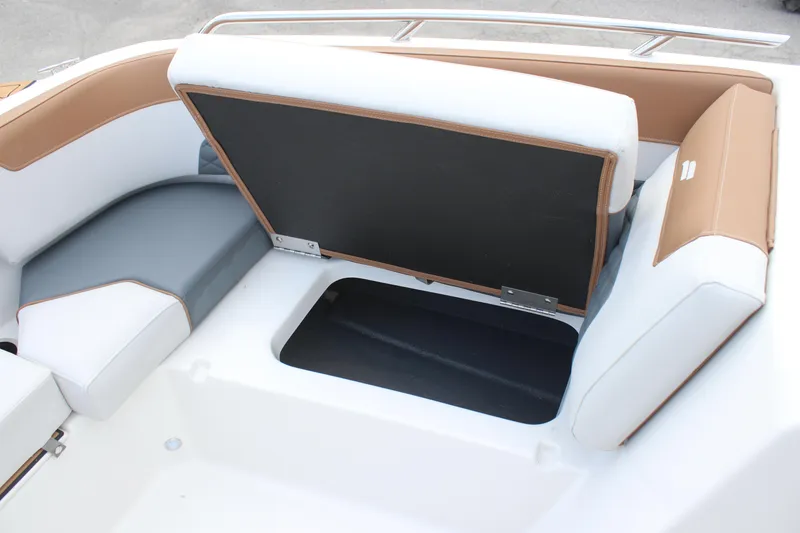 Slide: The Image of 2025 Starcraft SVX 210 OB DC boat seat with open storage compartment. - 14