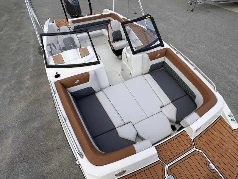 Slide: The Image of 2025 Starcraft SVX 210 OB DC boat with spacious seating and modern design. - 17
