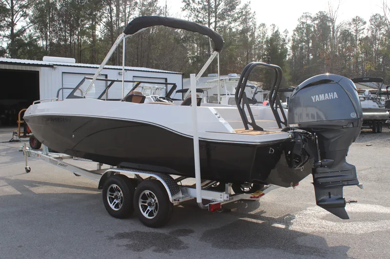 Slide: The Image of 2025 Starcraft SVX 210 OB DC boat on trailer with Yamaha outboard motor. - 4