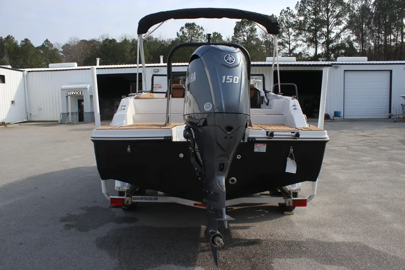 Slide: The Image of 2025 Starcraft SVX 210 OB DC boat with Yamaha 150 engine, rear view. - 5
