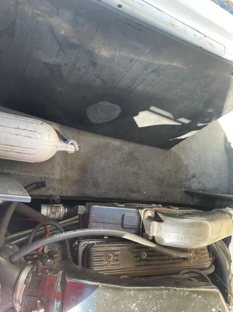 Slide: The Image of 1999 MasterCraft Prostar 205 engine compartment with visible components and wiring. - 11