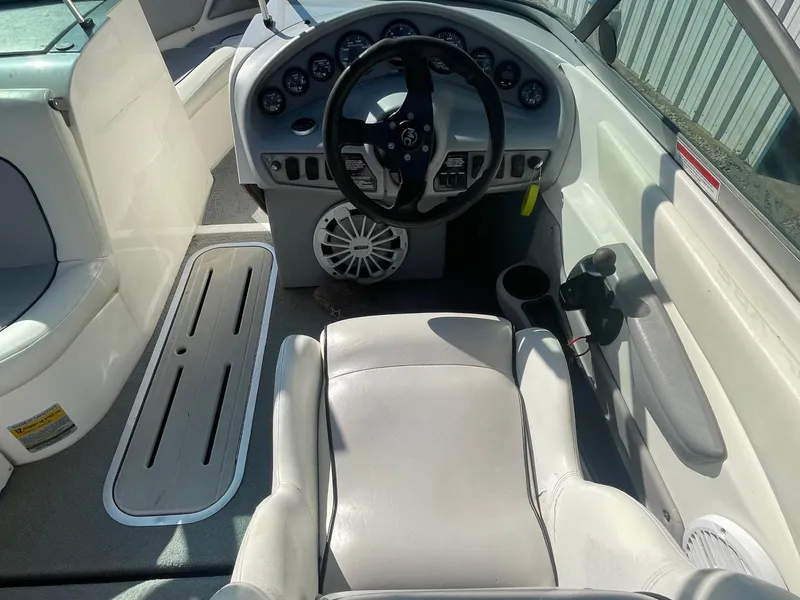 Slide: The Image of 1999 MasterCraft Prostar 205 boat interior with steering wheel and dashboard controls. - 3
